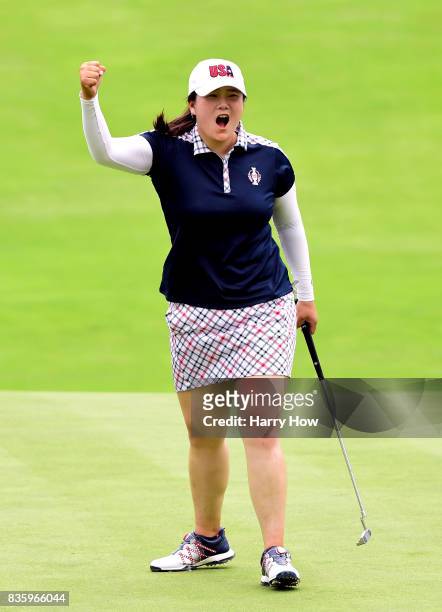 Angel Yin of Team USA celebrates her birdie on the 12th green during the final day singles matches of the Solheim Cup at the Des Moines Golf and...