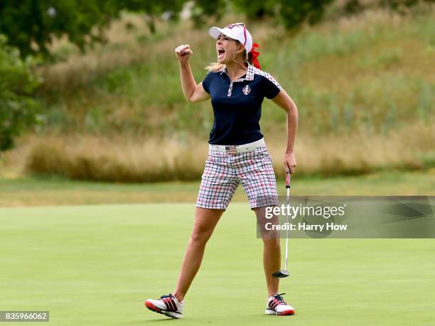 Paula Creamer of Team USA celebrates birdie on the 10th green during the final day singles matches of the Solheim Cup at the Des Moines Golf and...