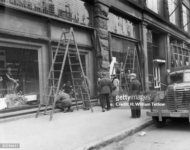 Repair work is carried out on the Montreal Forum, Montreal, Canada, after rhe previous night's riot over the suspension of Montreal Canadiens ice...