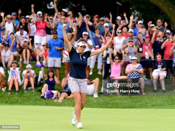 Gerina Piller of the United States celebrates her birdie to win her match four and two over Florentyna Parker of Team Europe during the final day...