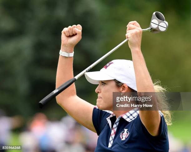 Cristie Kerr of Team USA celebrate her putt to beat Melissa Reid of Team Europe two and one during the final day singles matches of the Solheim Cup...