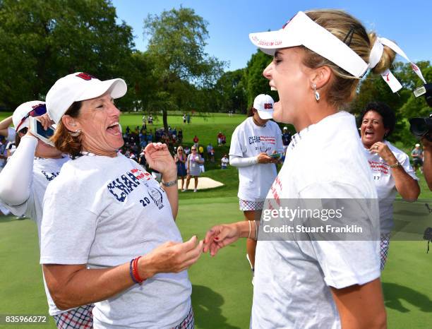 Juli Inkster, Captain of Team USA celebrates with Lexi Thompson after the final day singles matches of The Solheim Cup at Des Moines Golf and Country...