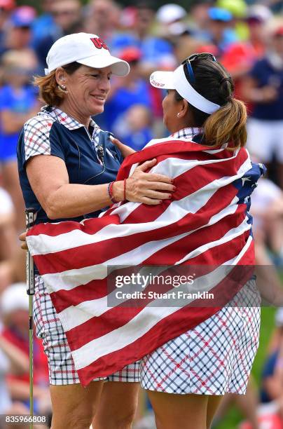 Juli Inkster, Captain of Team USA celebrates with Lizette Salas on the 18th hole during the final day singles matches of The Solheim Cup at Des...