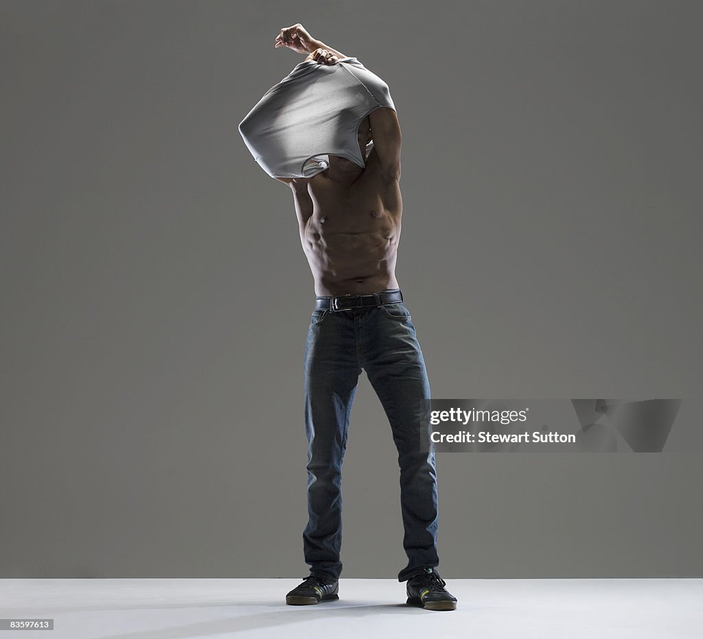 Man taking shirt off
