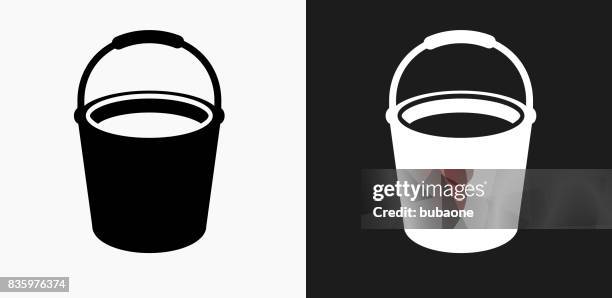 cleaning bucket icon on black and white vector backgrounds - buckets stock illustrations