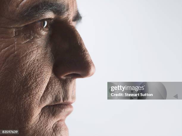 close-up of mature man's face - face profile stock pictures, royalty-free photos & images