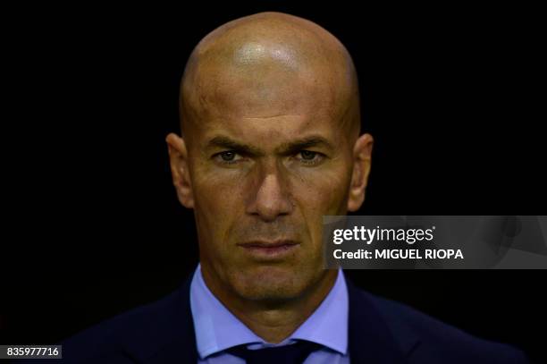 Real Madrid's French coach Zinedine Zidane observes a minute of silence in tribute to the victims of Barcelona and Cambrils attacks before the...