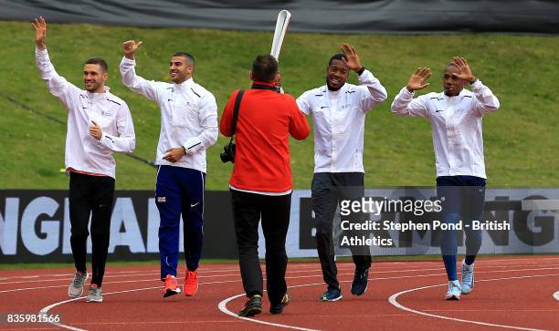 Chijindu Ujah, Adam Gemili, Daniel Talbot and Nethaneel Mitchell-Blake of Great Britain carry the Commonwealth baton around the track during the...