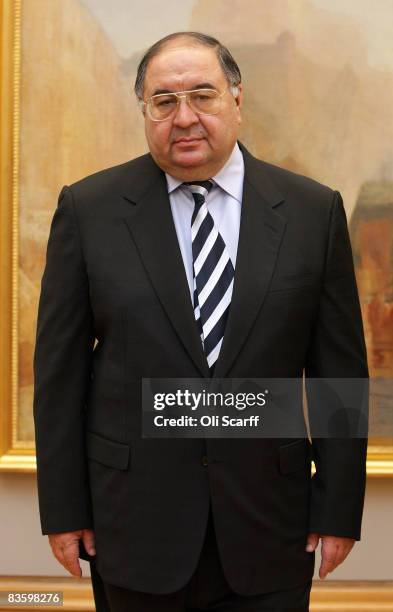 Russian oligarch Alisher Usmanov is pictured in front of JMW Turner's painting ' The Harbour of Brest ' in the Tate Britain art gallery on November...