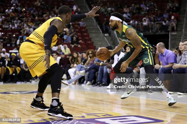 Xavier Silas of the Ball Hogs handles the ball against Stephen Jackson of the Killer 3s in week nine of the BIG3 three-on-three basketball league at...