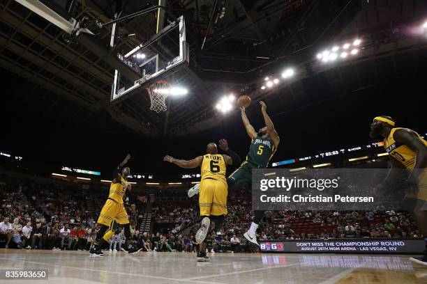 Xavier Silas of the Ball Hogs shoots the ball in front of Mo Evans of the Killer 3s in week nine of the BIG3 three-on-three basketball league at...