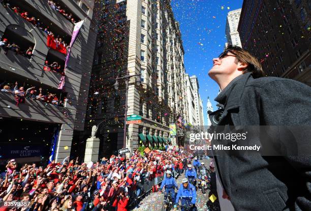 Philadelphia Phillies pitcher Cole Hamels watches the crowd on Broad Street in Philadelphia during a parade to celebrate winning the World Series on...