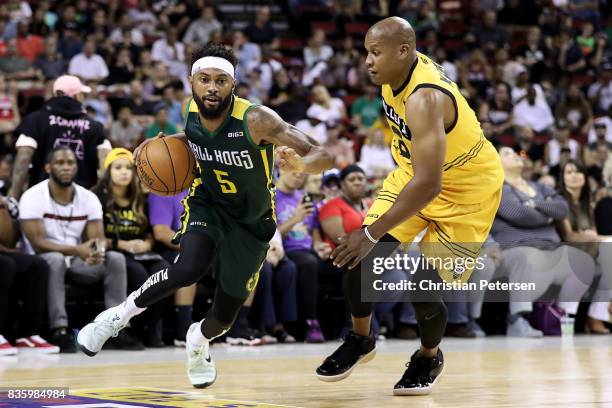 Xavier Silas of the Ball Hogs handles the ball against Mo Evans of the Killer 3s in week nine of the BIG3 three-on-three basketball league at...