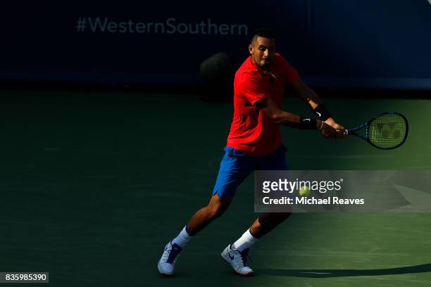 Nick Kyrgios of Austrailia returns a shot to Grigor Dimitrov of Bulgaria in the men's final on Day 9 of the Western and Southern Open at the Linder...