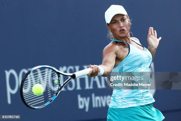 Yulia Putintseva of Kazakhstan returns a shot to Alize Cornet of France of during Day 3 of the Connecticut Open at Connecticut Tennis Center at Yale...