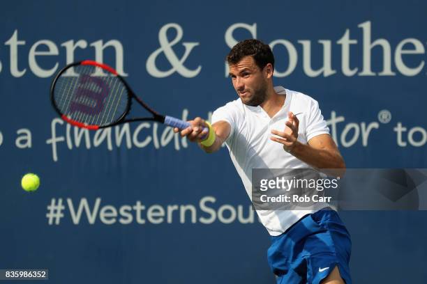 Grigor Dimitrov of Bulgaria returns a shot to Nick Kyrgios of Australia during the men's final during Day 9 of of the Western and Southern Open at...
