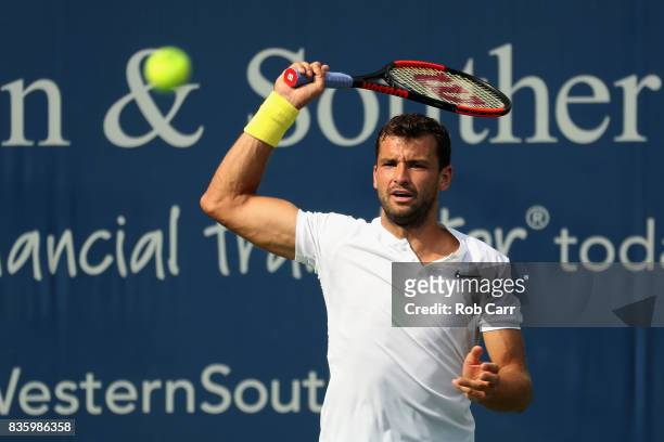 Grigor Dimitrov of Bulgaria returns a shot to Nick Kyrgios of Australia during the men's final during Day 9 of of the Western and Southern Open at...