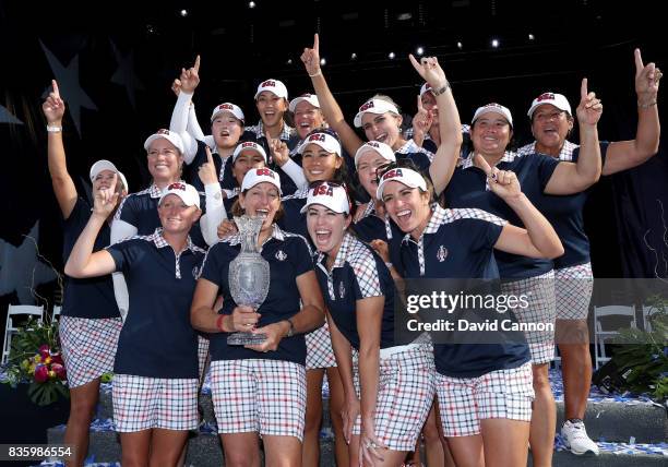 Juli Inkster the United States team captain holds the Solheim Cup with her team at the closing ceremony after the final day singles matches in the...