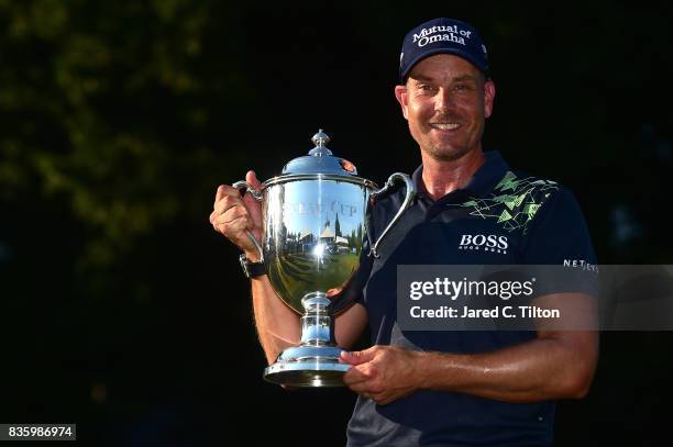 Henrik Stenson of Sweden poses with the trophy after winning the Wyndham Championship at Sedgefield Country Club on August 20, 2017 in Greensboro,...