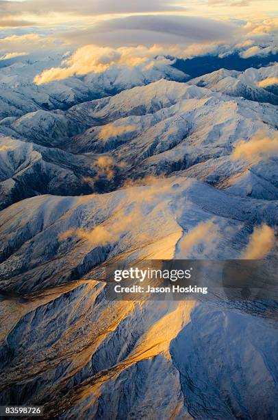 sun setting on southern alps mountain range - new zealand southern alps stock pictures, royalty-free photos & images