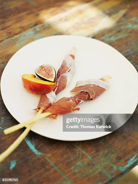 prosciutto wrapped grissini on platter - prosciutto wrapped stock pictures, royalty-free photos & images
