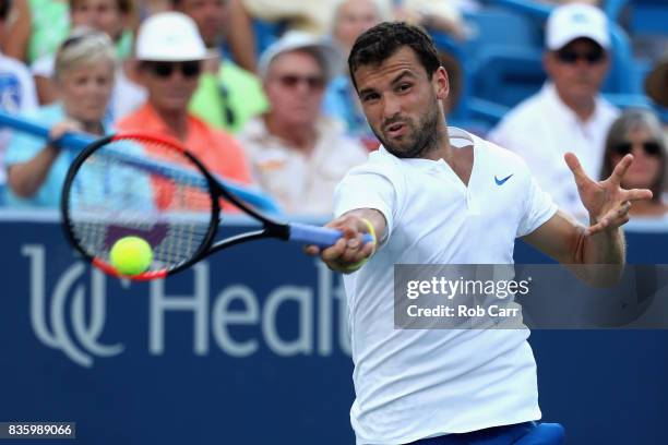 Grigor Dimitrov of Bulgaria returns a shot to Nick Kyrgios of Australia during the men's final during Day 9 of of the Western and Southern Open at...