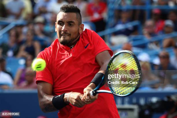 Nick Kyrgios of Australia Grigor returns a shot to Dimitrov of Bulgaria during the men's final during Day 9 of of the Western and Southern Open at...