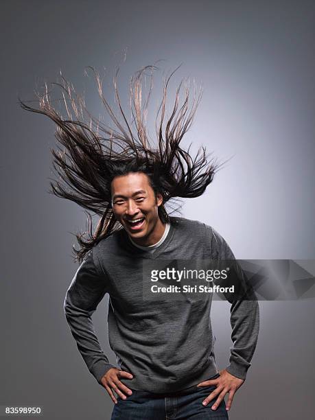 man laughing, hair blowing in wind - tousled hair man stock pictures, royalty-free photos & images