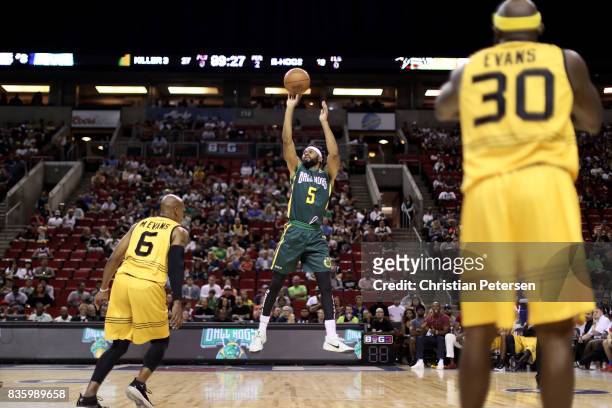 Xavier Silas of the Ball Hogs shoots the ball in front of Mo Evans of the Killer 3s in week nine of the BIG3 three-on-three basketball league at...