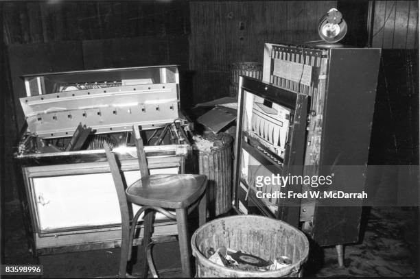View of a damaged jukebox and cigarette machine, along with a broken chair, inside the Stonewall Inn after riots over the weekend of June 27, 1969....