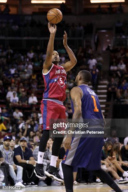 Dominic McGuire of the Tri-State shoots the ball over DerMarr Johnson of the 3's Company in week nine of the BIG3 three-on-three basketball league at...