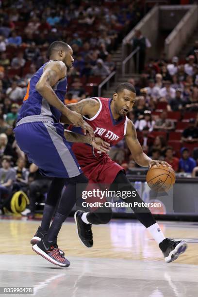 Dominic McGuire of the Tri-State handles the ball against DerMarr Johnson of the 3's Company in week nine of the BIG3 three-on-three basketball...