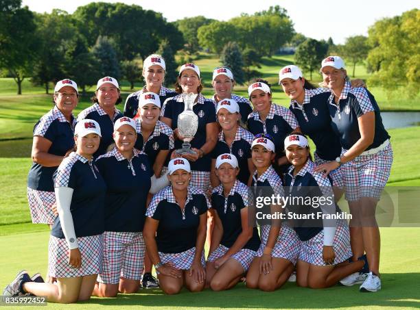 Team USA pose with the Solheim Cup trophy after the final day singles matches of The Solheim Cup at Des Moines Golf and Country Club on August 20,...