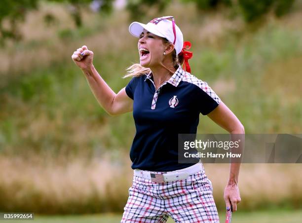 Paula Creamer of Team USA celebrates birdie on the 10th green during the final day singles matches of the Solheim Cup at the Des Moines Golf and...