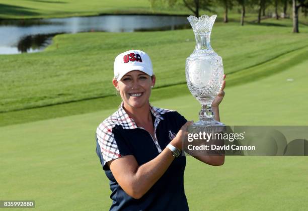 Cristie Kerr of the United States Team holds the Solheim Cup after the closing ceremony during the final day singles matches in the 2017 Solheim Cup...