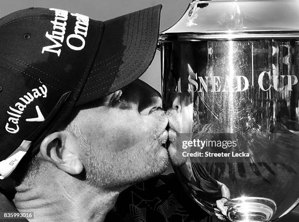 Henrik Stenson poses with the trophy after winning the Wyndham Championship during the final round at Sedgefield Country Club on August 20, 2017 in...