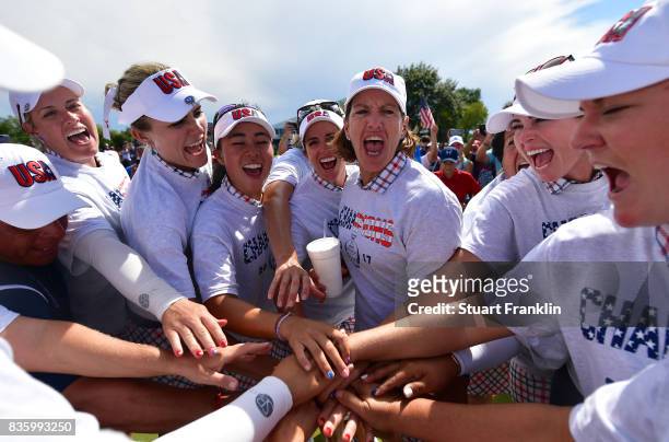 Juli Inkster, Captain of Team USA leads her team's celebrateion during the final day singles matches of The Solheim Cup at Des Moines Golf and...