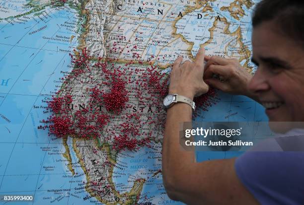 Visitor puts a pin on map to show where she is visiting from during the Wyoming Eclipse Festival on August 20, 2017 in Casper, Wyoming. Thouands of...