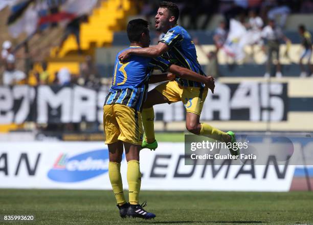 Real SC defender Jorge Bernardo from Portugal celebrate with teammate Real SC defender Joao Basso from Brazil after scoring a goal during the Segunda...