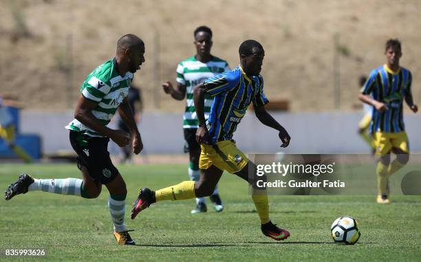 Real SC forward Marcos Barbeiro from Sao Tome and Principe with Sporting CP B defender David Sualehe in action during the Segunda Liga match between...