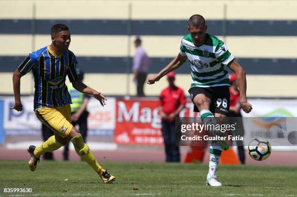 Sporting CP B defender Merih Demiral with Real SC forward Carlos Vincius from Brazil in action during the Segunda Liga match between Real SC and...