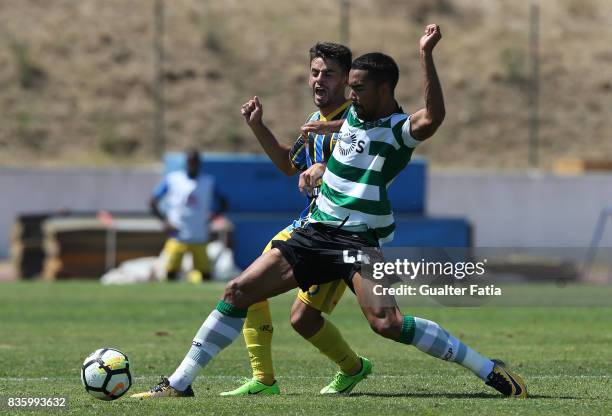 Sporting CP B midfielder Pedro Delgado with Real SC defender Jorge Bernardo from Portugal in action during the Segunda Liga match between Real SC and...
