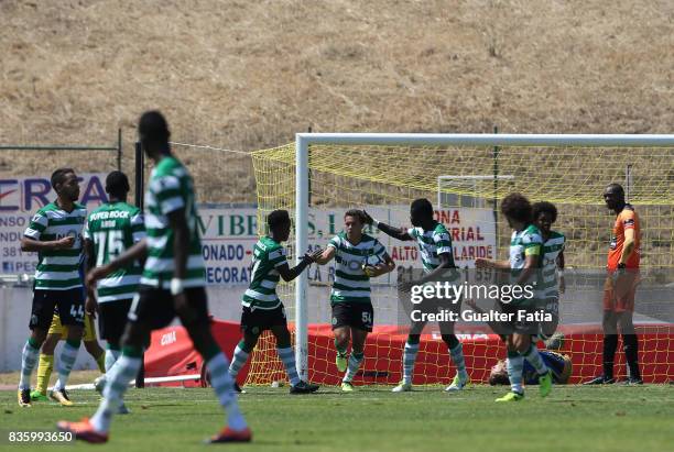 Sporting CP B forward Pedro Marques celebrates with teammates after scoring a goal during the Segunda Liga match between Real SC and Sporting CP B at...