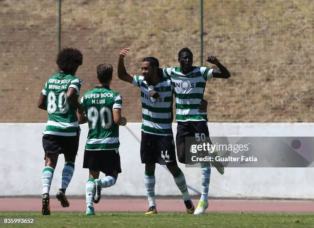 Sporting CP B midfielder Pedro Delgado celebrates with teammates after scoring a goal during the Segunda Liga match between Real SC and Sporting CP B...
