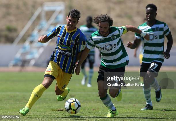 Real SC midfielder Tiago Morgado from Portugal with Sporting CP B midfielder Rafael Barbosa in action during the Segunda Liga match between Real SC...