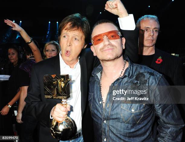 Sir Paul McCartney poses with his Ultimate Legend Award alongside Bono in the Glamour Pit at the 2008 MTV Europe Music Awards held at at the Echo...