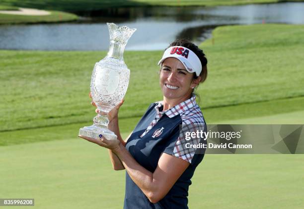 Gerina Piller of the United States Team holds the Solheim Cup after the closing ceremony during the final day singles matches in the 2017 Solheim Cup...