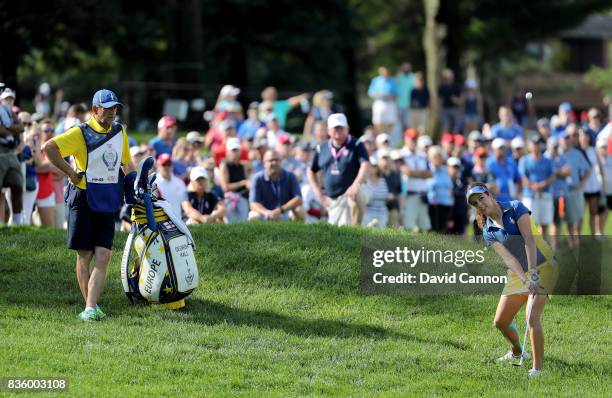 Georgia Hall of England and the European team in action with her father Wayne Hall caddying against Paula Creamer of the United States team during...