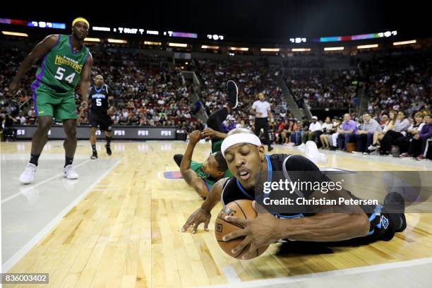 Jerome Williams of the Power dives for the ball against Rashard Lewis of the 3 Headed Monsters in week nine of the BIG3 three-on-three basketball...