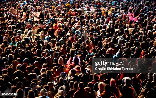 Festival goers enjoy P!nk performing live on stage during V Festival 2017 at Weston Park on August 20, 2017 in Stafford, England.